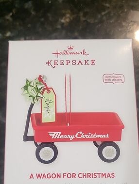 Hallmark red wagon ornament with green bow